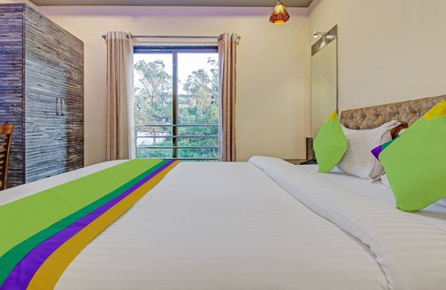 Wai Hotel | Budget-Friendly Treebo Dreamworld with Family Amenities