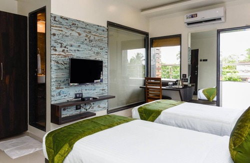 Nigdi Hotel | Budget-Friendly Stay at Treebo Malhaar Regency with Dining