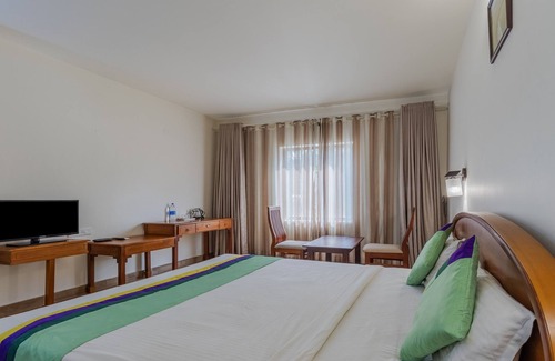 Kannur Hotel | Relax at Treebo Sadhoo Heritage Spa with Pool & Kitchen