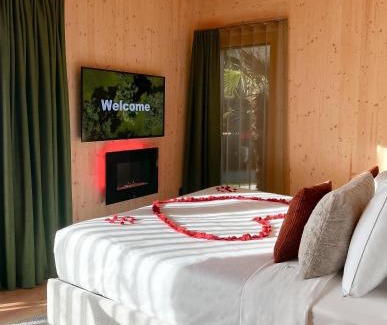 Riva del Garda Resort | Idyllic TreeLodgy: Oceanfront Escape with Pool & Spa