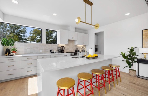 MLK House | Trendy East Austin Condo with Rooftop Deck and City Views