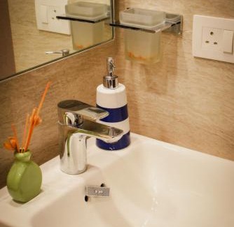 Hiranandani Gardens Apartment | Trendy 1BR Retreat with Smart Kitchen & Family-Friendly Perks
