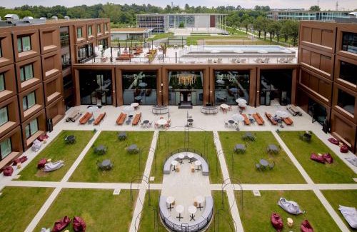 Vizzola Ticino Hotel | Elegant TRIBE Milano Malpensa: Pet-Friendly with Pool Access