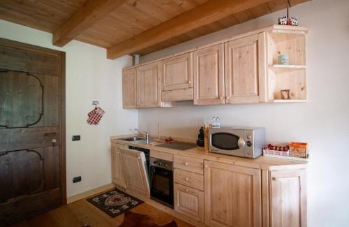 Ponte di Legno Apartment | Dine in Tranquility at TRILOCALE ALPES: Relax and Unwind