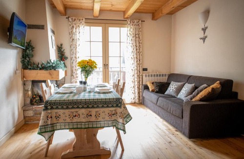 Ponte di Legno Apartment | Dine in Tranquility at TRILOCALE ALPES: Relax and Unwind