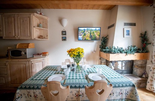 Ponte di Legno Apartment | Dine in Tranquility at TRILOCALE ALPES: Relax and Unwind
