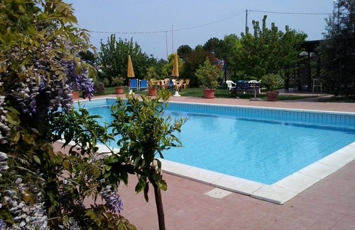 Quartiere Cervese Nord Apartment | Trilocale with Pool Access and Oceanfront Views