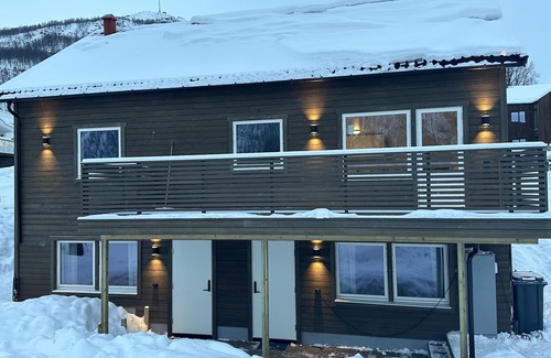 Tromsdalen House | Explore Tromsdalen Aurora Apartments with Pool and Spa Access
