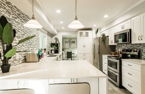 Longwood House | Indulgent Tropical Oasis with Heated Pool & Game Room