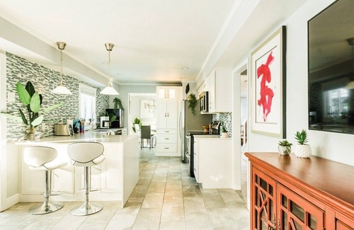 Longwood House | Indulgent Tropical Oasis with Heated Pool & Game Room