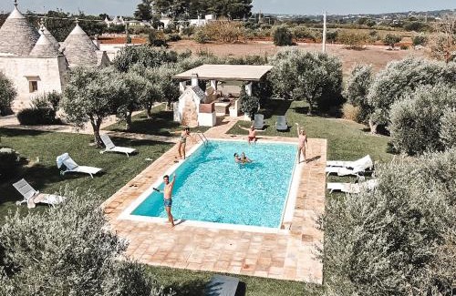 Martina Franca Villa | Relax at Trulli Terrarossa with Pool & Family-Friendly Fun