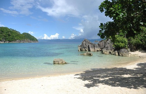 Caramoan Resort | Experience Tugawe Cove Resort: Beachfront Bliss Awaits