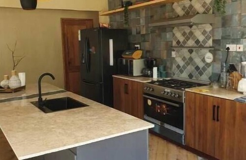 Moshi Apartment | Tulivu Escape: Room 3