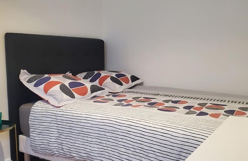 Osny Apartment | Discover Tulsa Home: Modern 2-Bedroom with Private Terrace