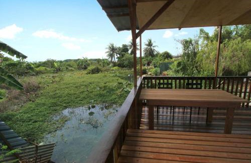 Ipoh House | Tranquil Tung's Tropika: Lakeside Hut with Unique Amenities