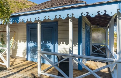 Frigate Bay Cabin | Charming Turtle Beach White House: Romantic Cottage Retreat