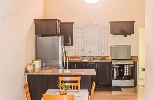 Mammee Bay House | Relax at Twin Peak Cottage: Family-Friendly with Pool & Breakfast