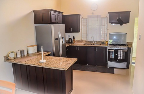 Mammee Bay House | Relax at Twin Peak Cottage: Family-Friendly with Pool & Breakfast