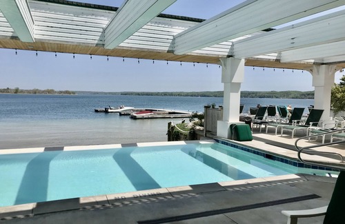 Onekama Condo | Experience Two Lakes & Pool: 1st Floor Condo Retreat