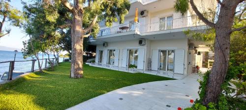 Lygia Apartment | Oceanfront Tzeni Villa - Rated 9.1/10 Family Getaway