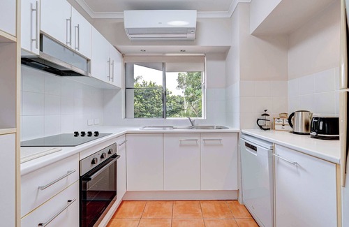 Wongaling Beach Apartment | Beachfront Escape at Ulysses One with Private Pool & Kitchen