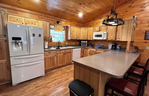 Spencer Cabin | Cozy 3-Bed Cabin with Fireplace and Waterfall Oasis