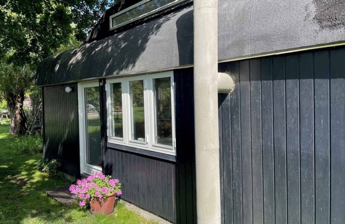 Smidstrup Strand Cottage | Quirky Circus Wagon: Oceanfront Oasis Near the Beach