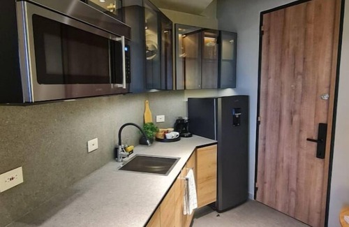 Calle 100 Apartment | Stylish Loft with Balcony, Pool & Spa Access Await You