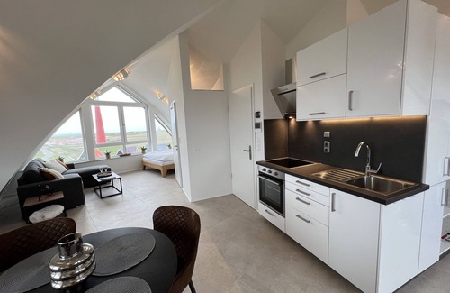 Huisduinen Apartment | Sea View Loft Retreat with Pool & Breakfast - Loft Seaview