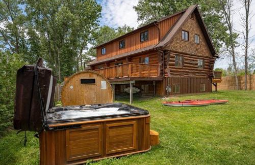 Brighton House | Enchanting Log House Retreat with Spa by Presque'ile Park