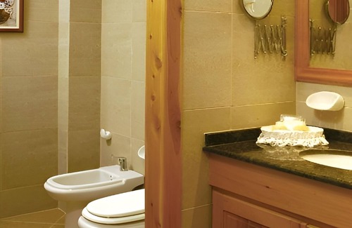 San Carlos de Bariloche Hotel | Unwind in a Spacious Room with Panoramic Nahuel Huapi Views – Ideal Location