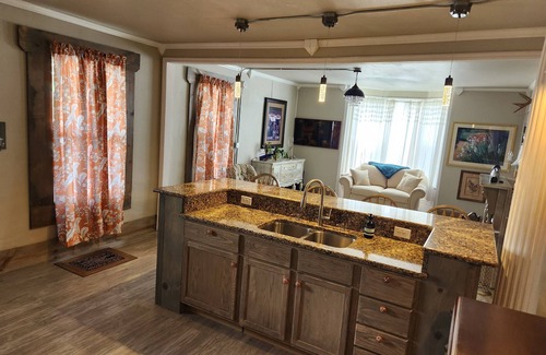 Lansing House | Relax at the Opal Suite of Lotus House - Rated 10/10!