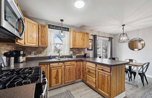 Lansing House | Comfortable Lansing Home with Basement Theater Room