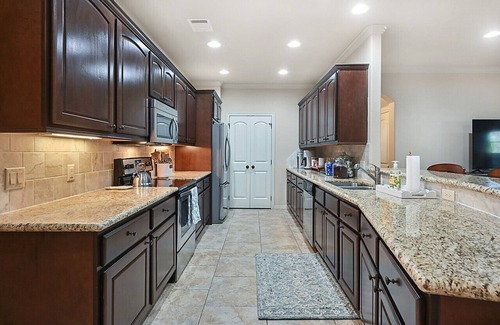 College Station House | Uptown Aggie - Family-Friendly Rentals with Pool & Breakfast
