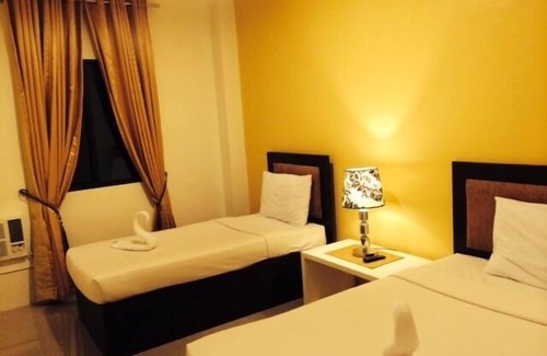 Roxas City Hotel | Cozy Urban Manor Hotel Annex: Family-Friendly Retreat