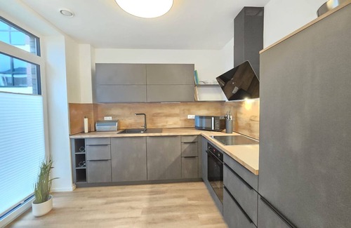 Norden Apartment | Vacation apartment Meeresrauschen on the first floor with garden, sauna and pet