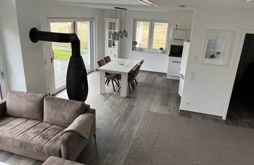 Lobnitz House | Idyllic Lakefront Getaway with Private Beach and Sauna