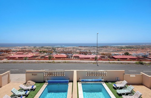 Caleta de Fuste House | Villa Mia: Sea View Getaway with Pool & Family Amenities