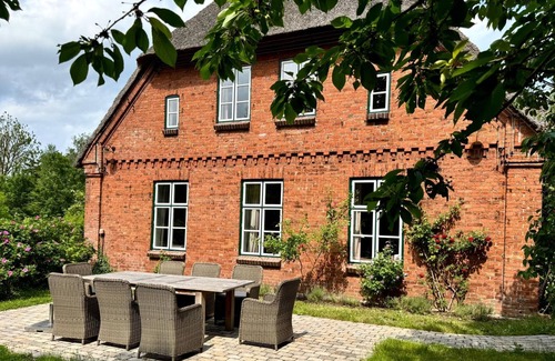Kohn House | Vacations under a thatched roof - not far from Lake Selent and the Baltic Sea