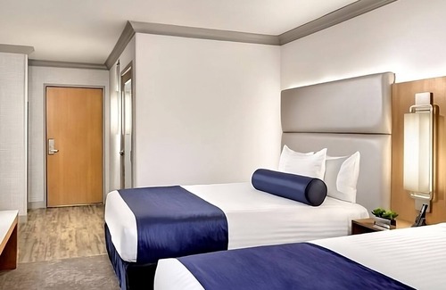 Gateway District Hotel | Budget-Friendly Retreat with Pools, Game Room & Parking