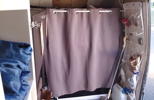 Millenaire House | Van set up in a PUBLIC parking lot that's good for repairs