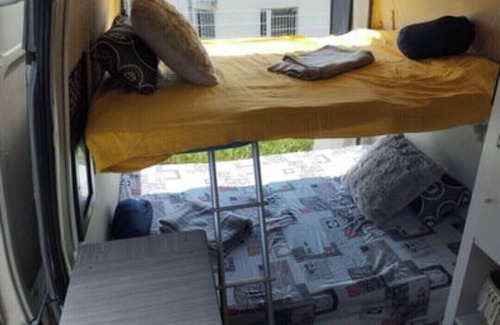 Millenaire House | Van set up in a PUBLIC parking lot that's good for repairs