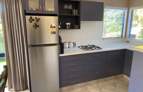Papamoa Beach House | Private Modern Flat by Reserve with Oceanfront Amenities