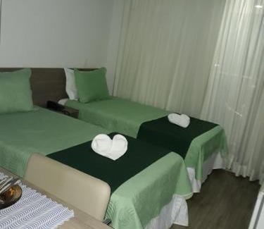 Camorim Hotel | Elegant Via Première Suite with City Views Near Riocentro