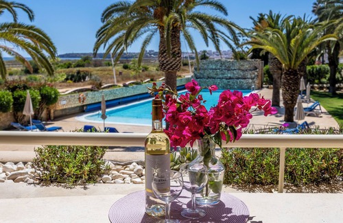 Meia Praia Apartment | Experience Vila Palmeira: Oceanfront Escape with Spa & Pool