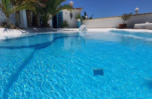 Arico House | Experience Villa Adriano: 4-Star Stay with Oceanfront Pool