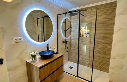 Aviles Apartment | Villa Ana: Central, Serene Retreat with Family-Friendly Perks