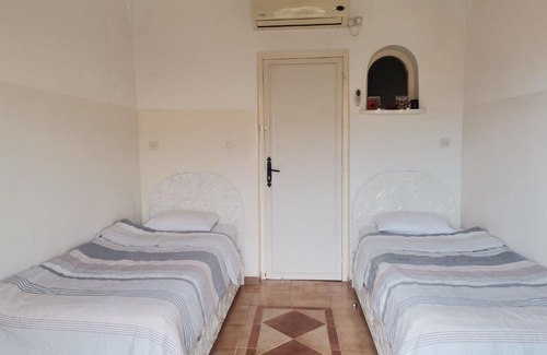 Imi Ouaddar Villa | ```html
Relax at Villa Atlas: Pet-Friendly with Pool & Family Fun
```