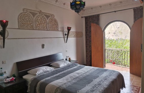 Imi Ouaddar Villa | ```html
Relax at Villa Atlas: Pet-Friendly with Pool & Family Fun
```