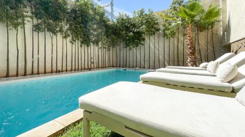 Annakhil Villa | Villa AZUR: Poolside Paradise in Marrakech with Ocean Views